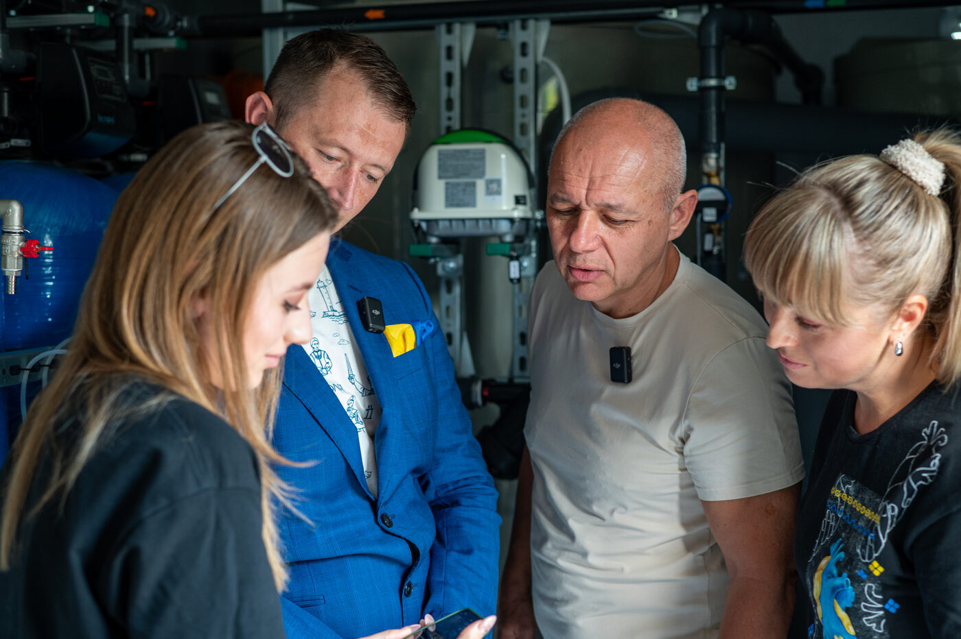 Operators inside a purification unit inspecting filtration systems